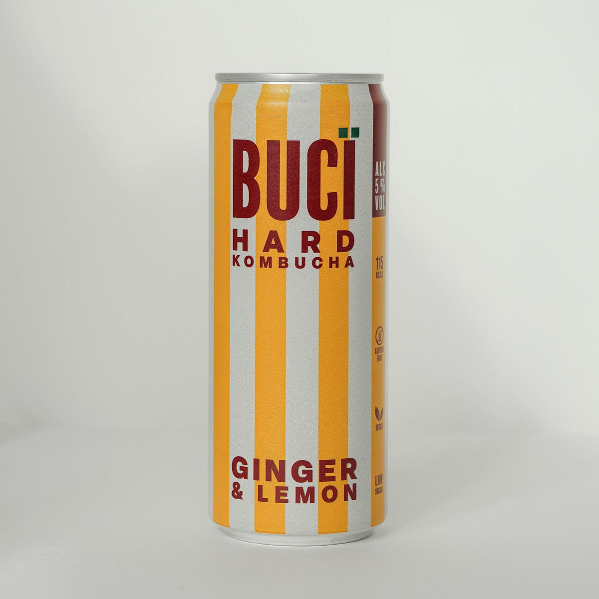 Buci Hard Kombucha can with ginger and lemon flavor on a white background