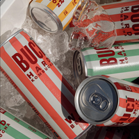 Multiple cans of BUCÏ Hard Kombucha lying in a bucket of ice.