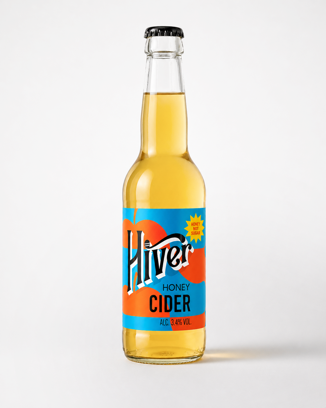 Studio product shot of Hiver Honey Cider bottle labelled 'Honey not sugar' on white background
