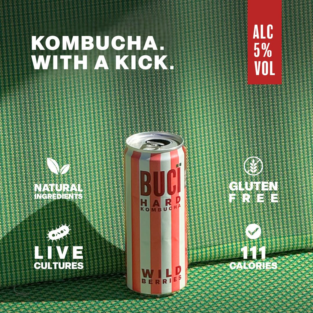 Buci Hard Kombucha can on a green patterned background with product details.Wild Berries Raspberry passionfruit hibiscus